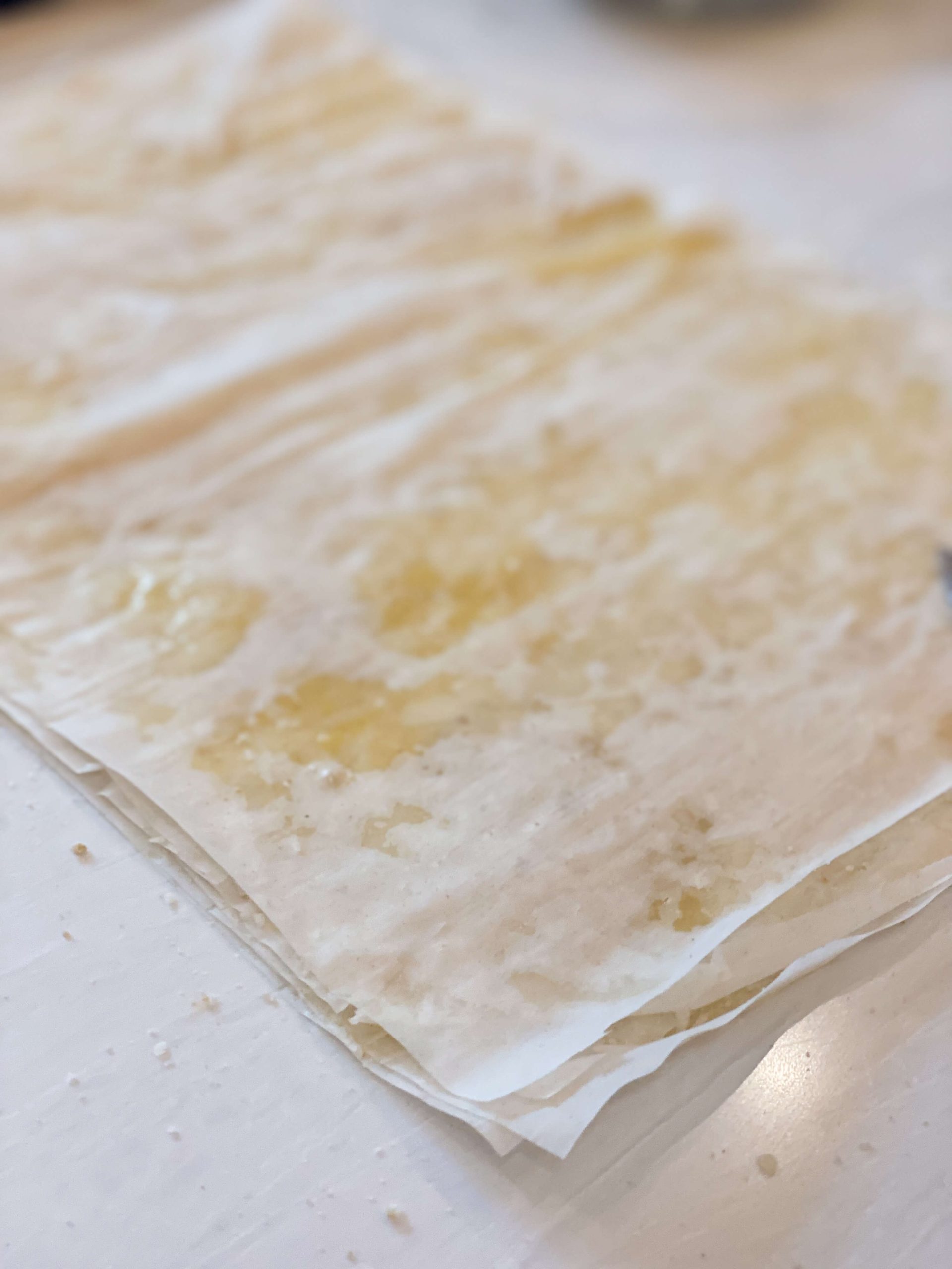 phyllo dough arranged in layers with butter and breadcrumbs in between 