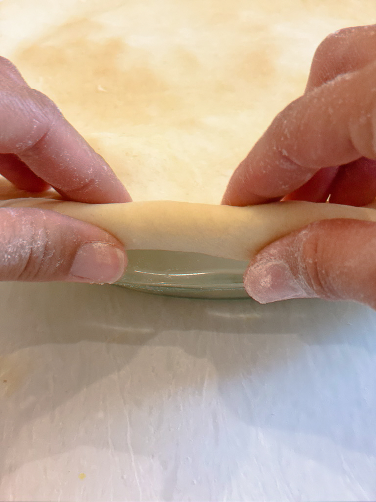 crimping the edges of the chicken pot pie crust