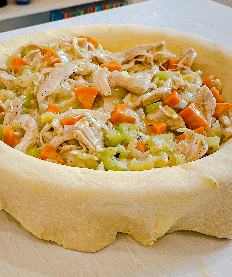 bottom crust of the chicken pot pie with the filling in it