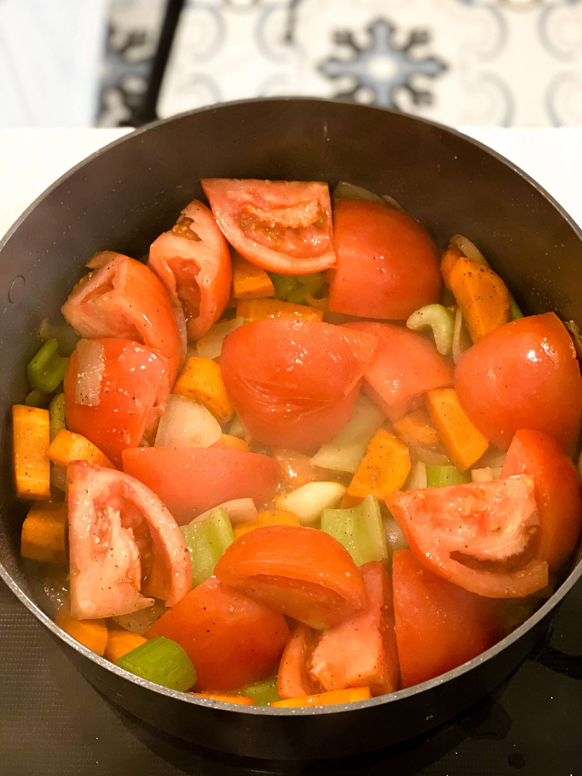 vegetables starting to soften for the creamy tomato soup recipe