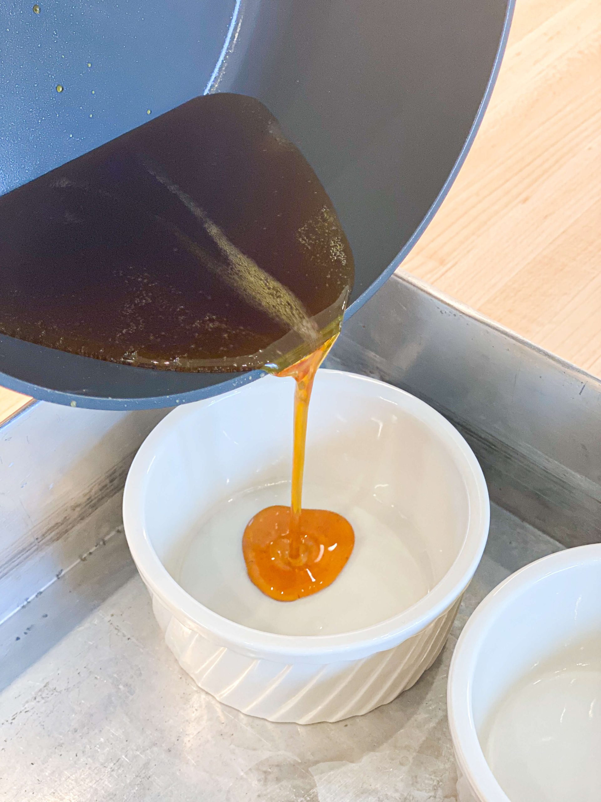 caramel pouring in ramekins