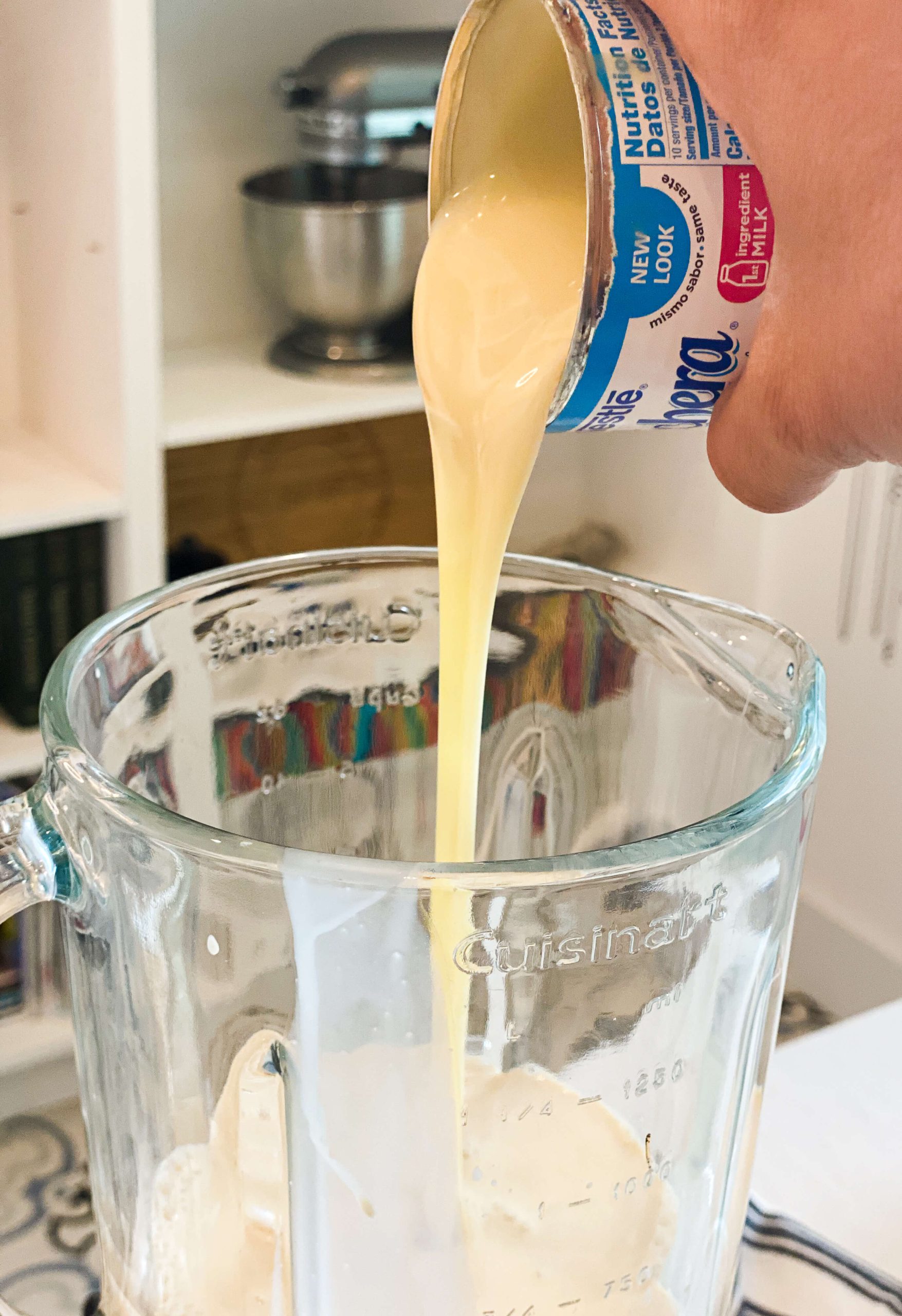 condensed milk getting poured into blender