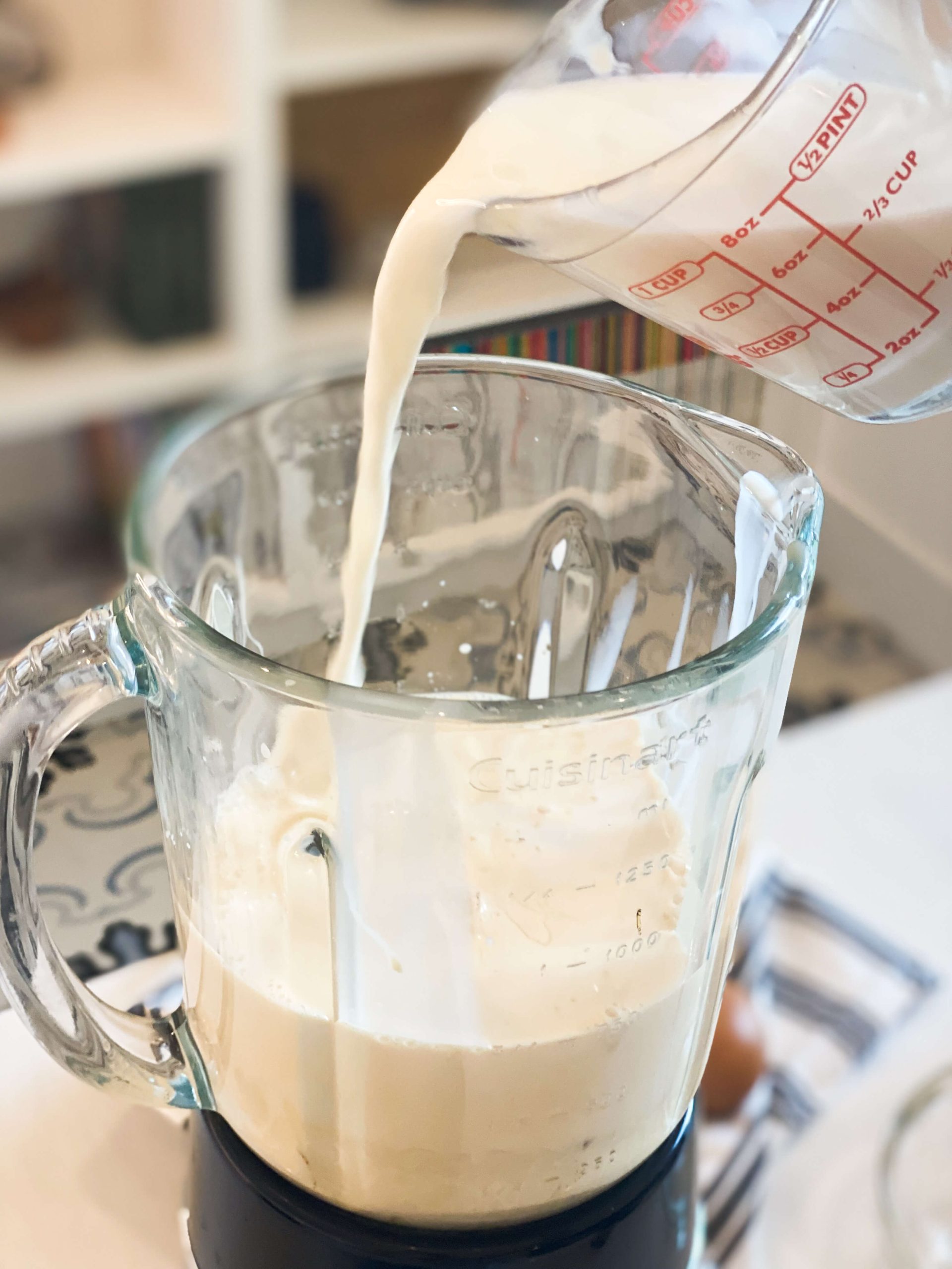 whole milk getting poured into blender