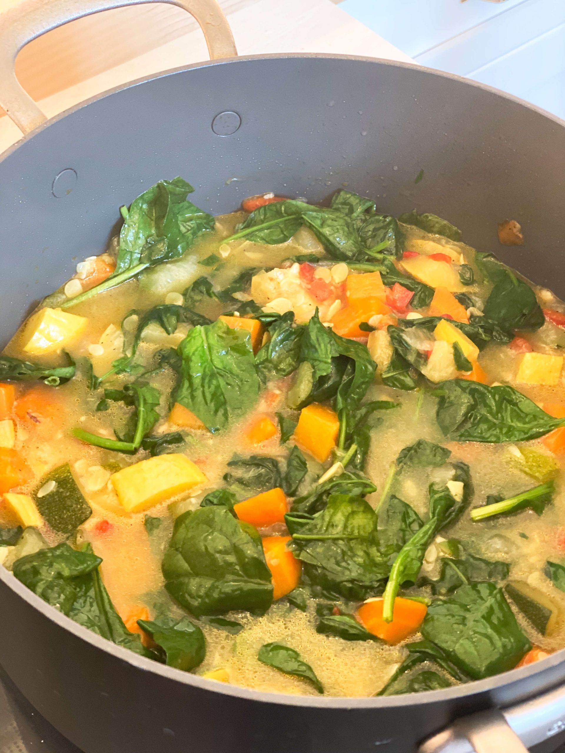 spinach mixed in with vegetable mixture