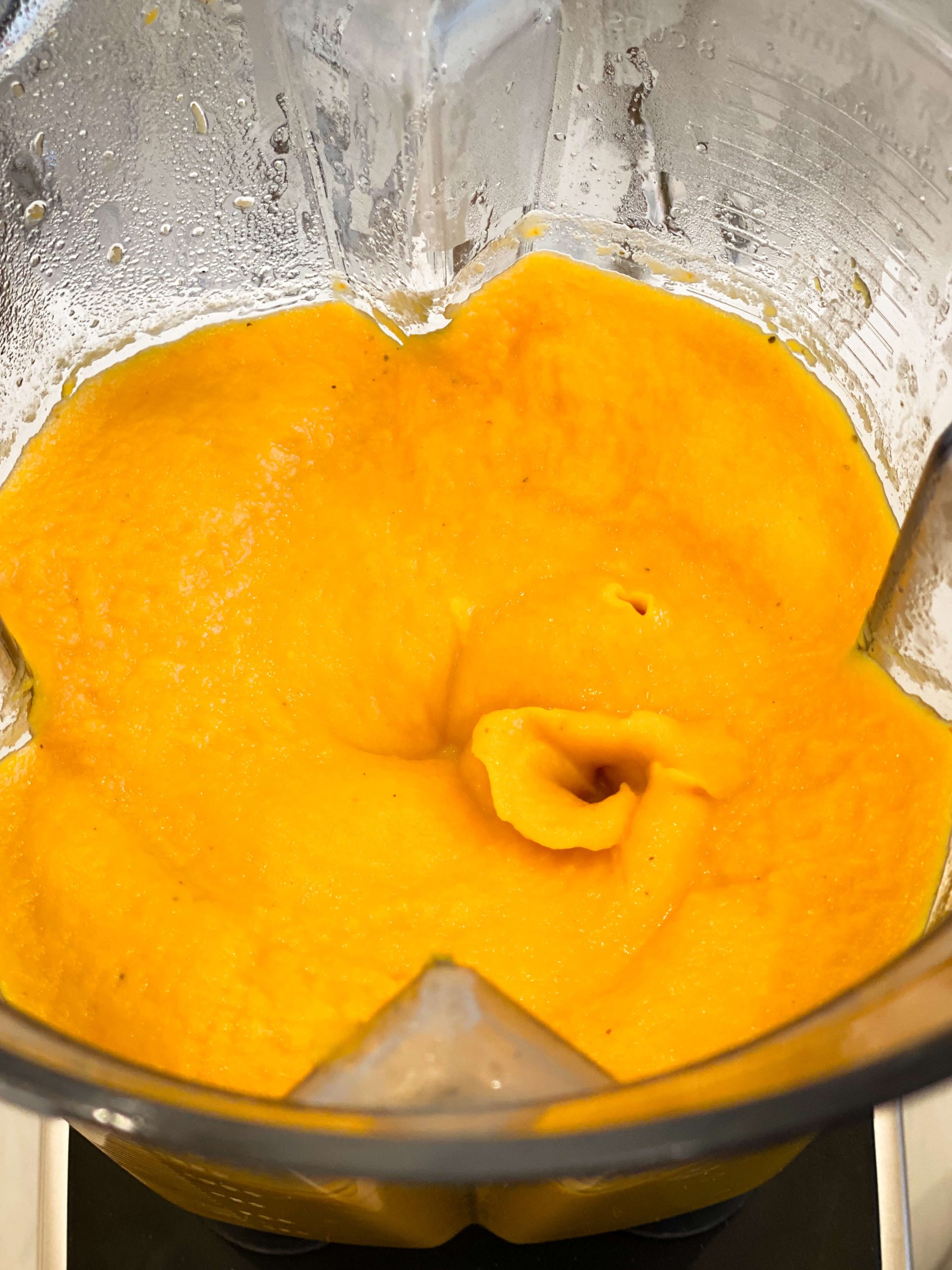 Vegetables pureed in the blender for the butternut squash soup
