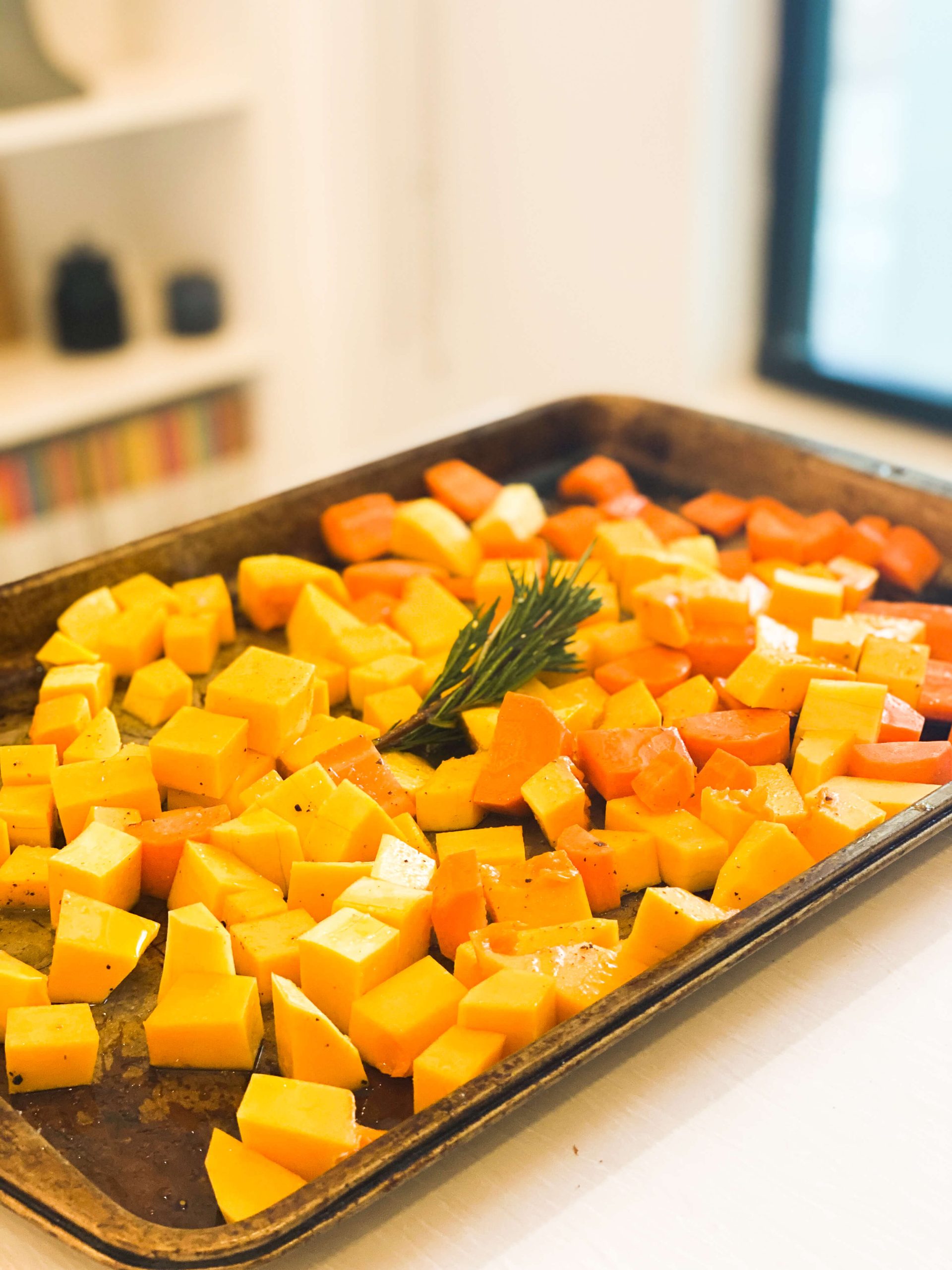 Butternut squash, carrots, rosemary and ginger tossed in olive oil slat and pepper. 
