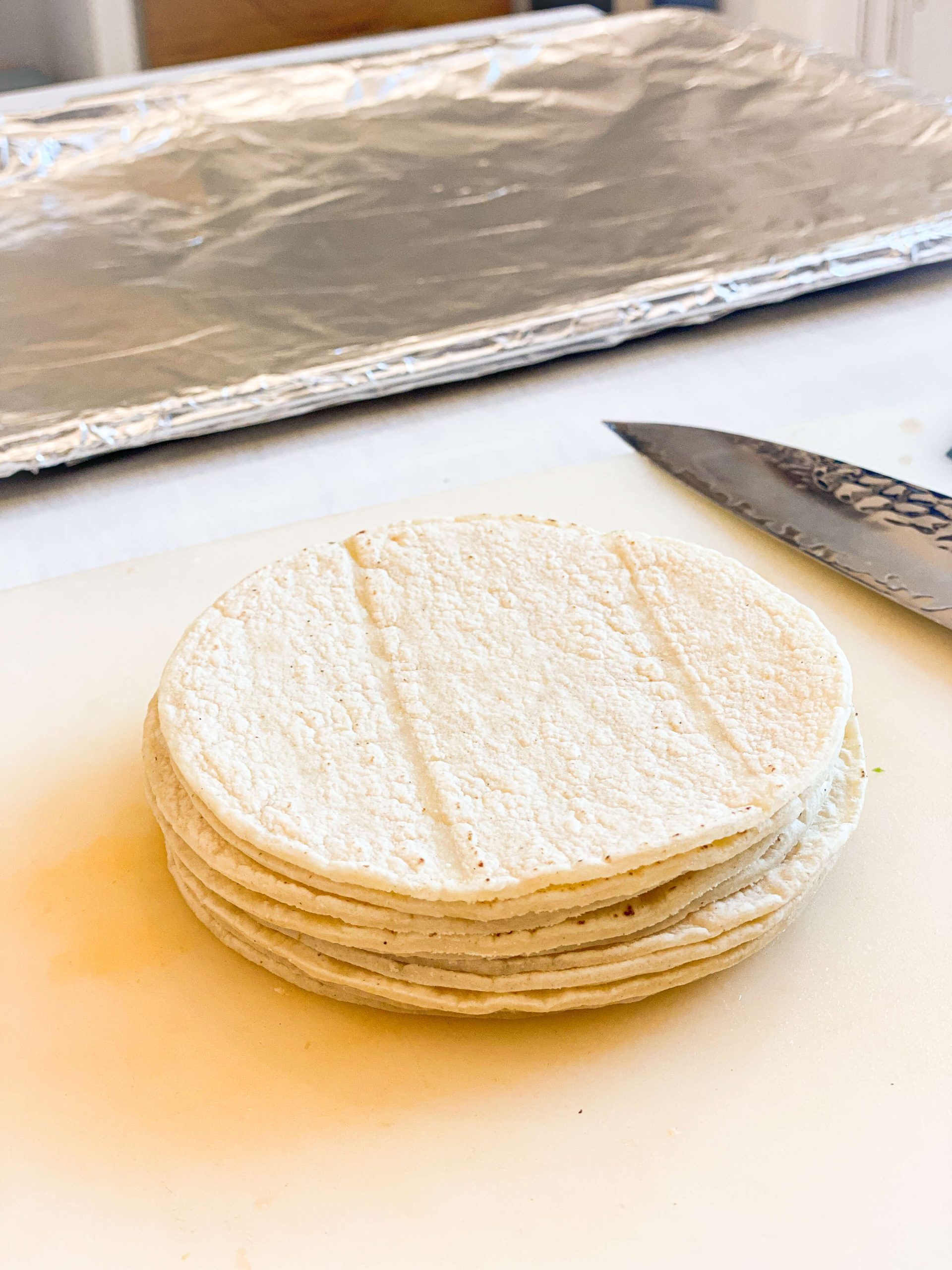 Tortillas lined up to slice 