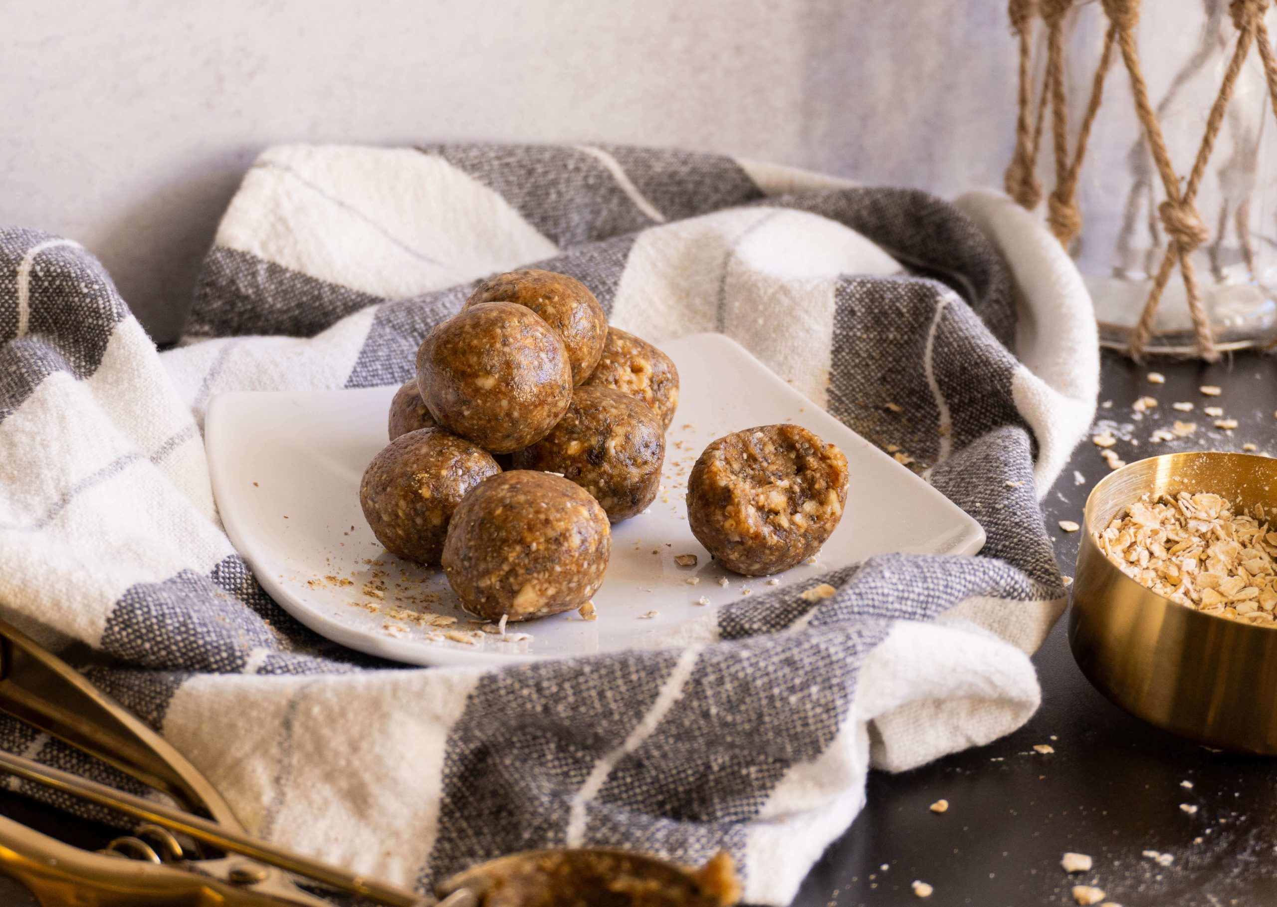 Cashew energy balls served and one with one bite