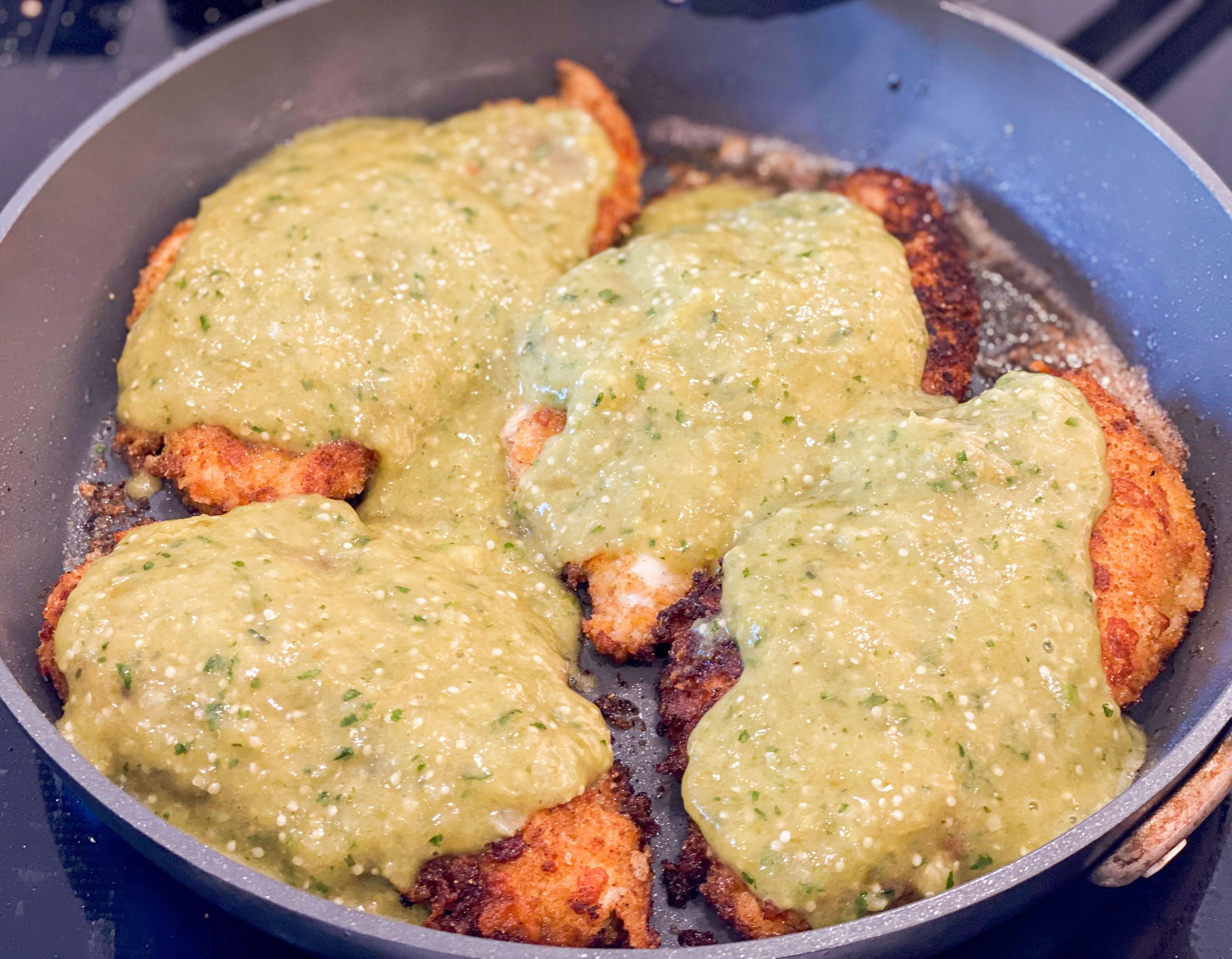 chicken cutlets covered in salsa verde