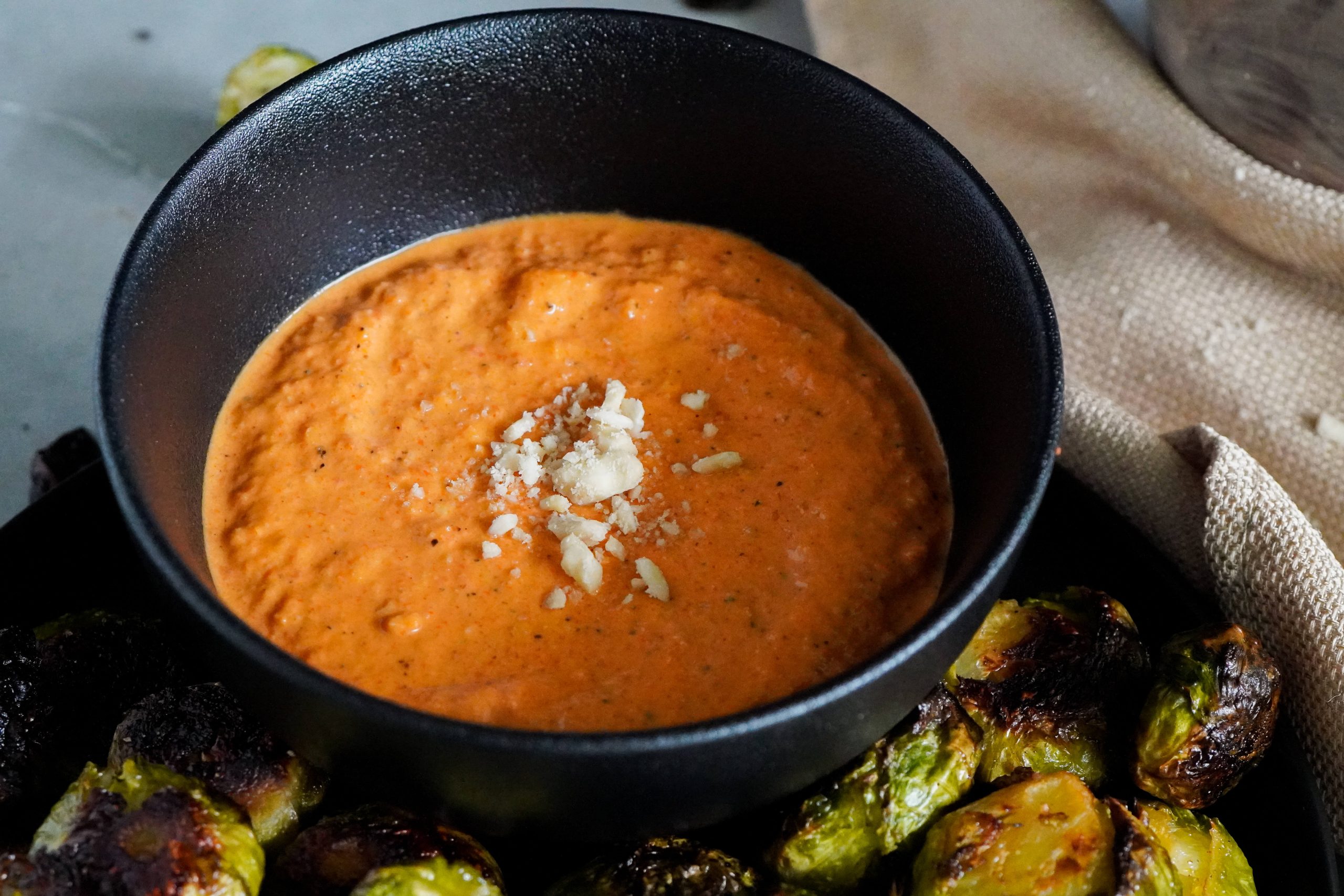 romesco aioli served next to the roasted brussel sprouts 