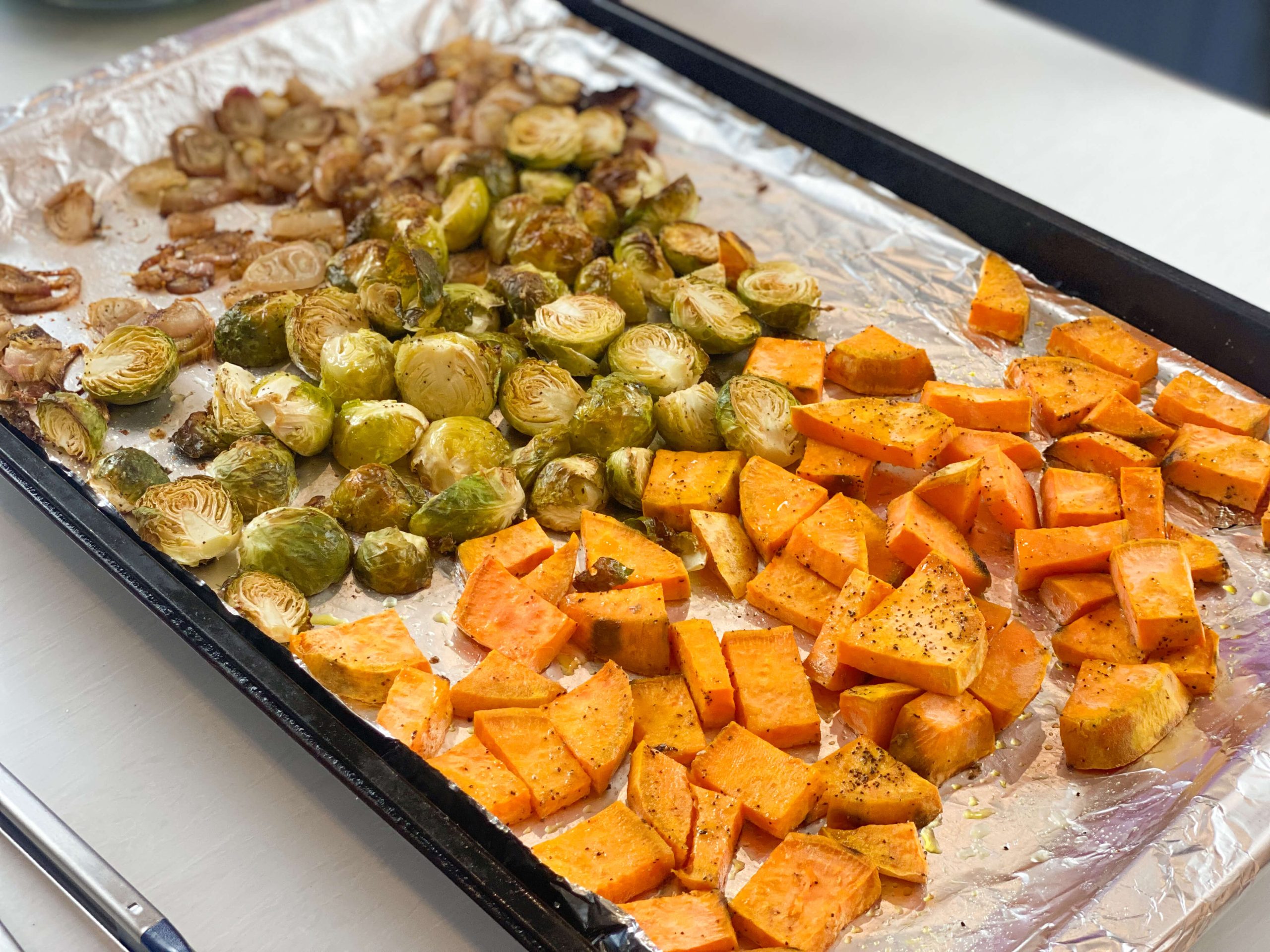 Shallots, brussels sprouts and sweet potatoes, roasted and cooling. 