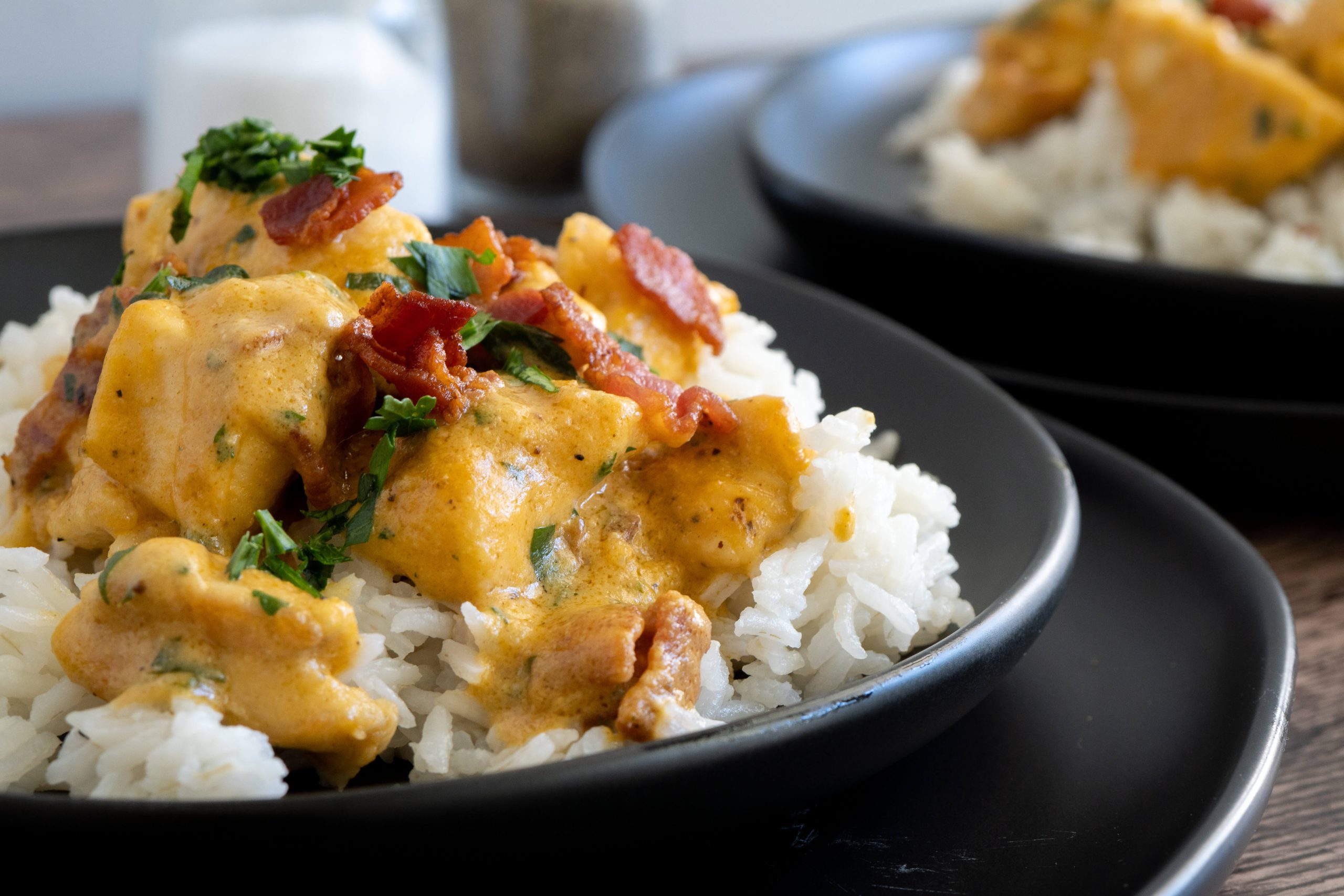 maple dijon chicken served over rice with crispy bacon bits