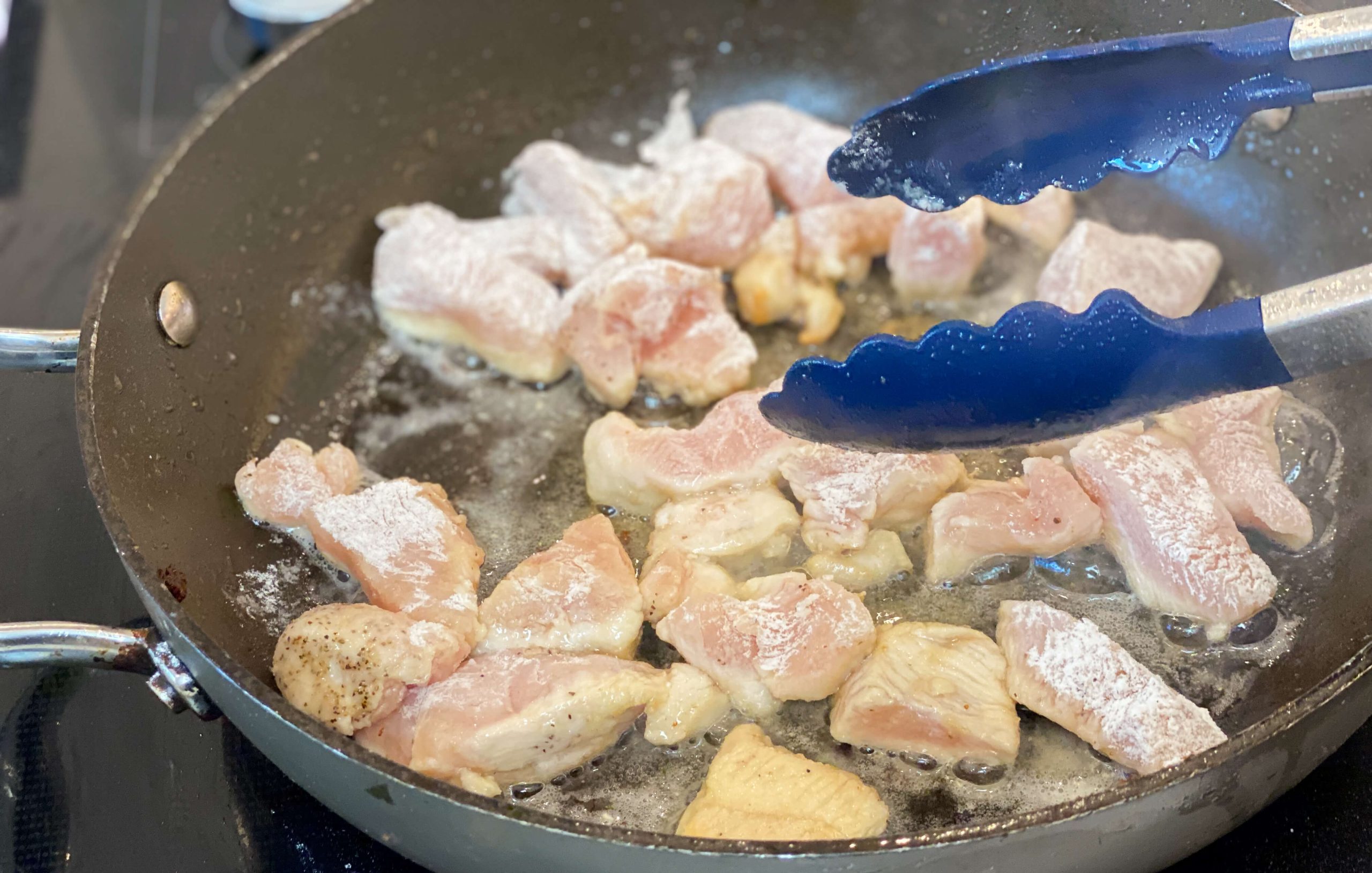 chicken cooking in bacon fat