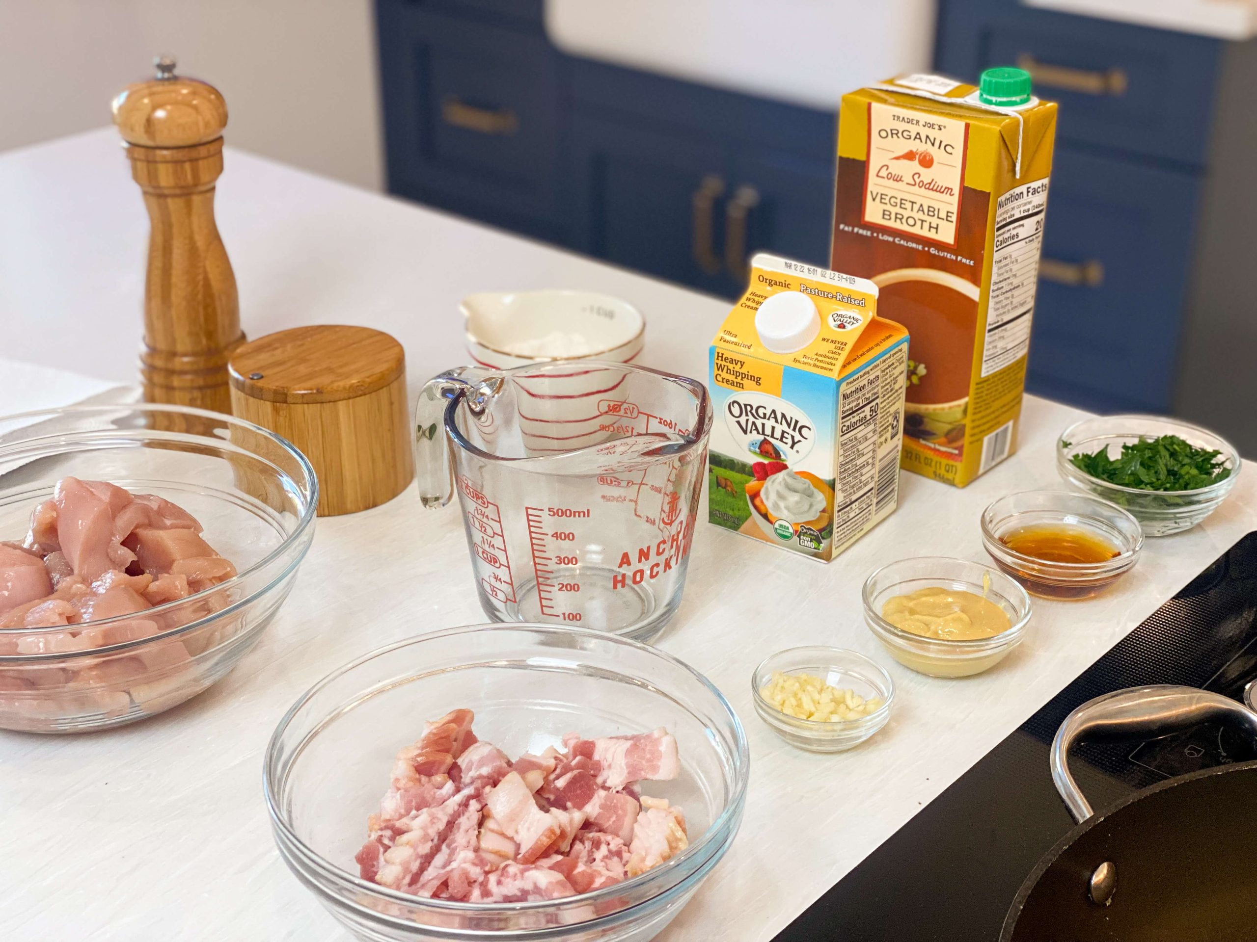 mise en place of all the ingredients needed for the maple dijon chicken with bacon 