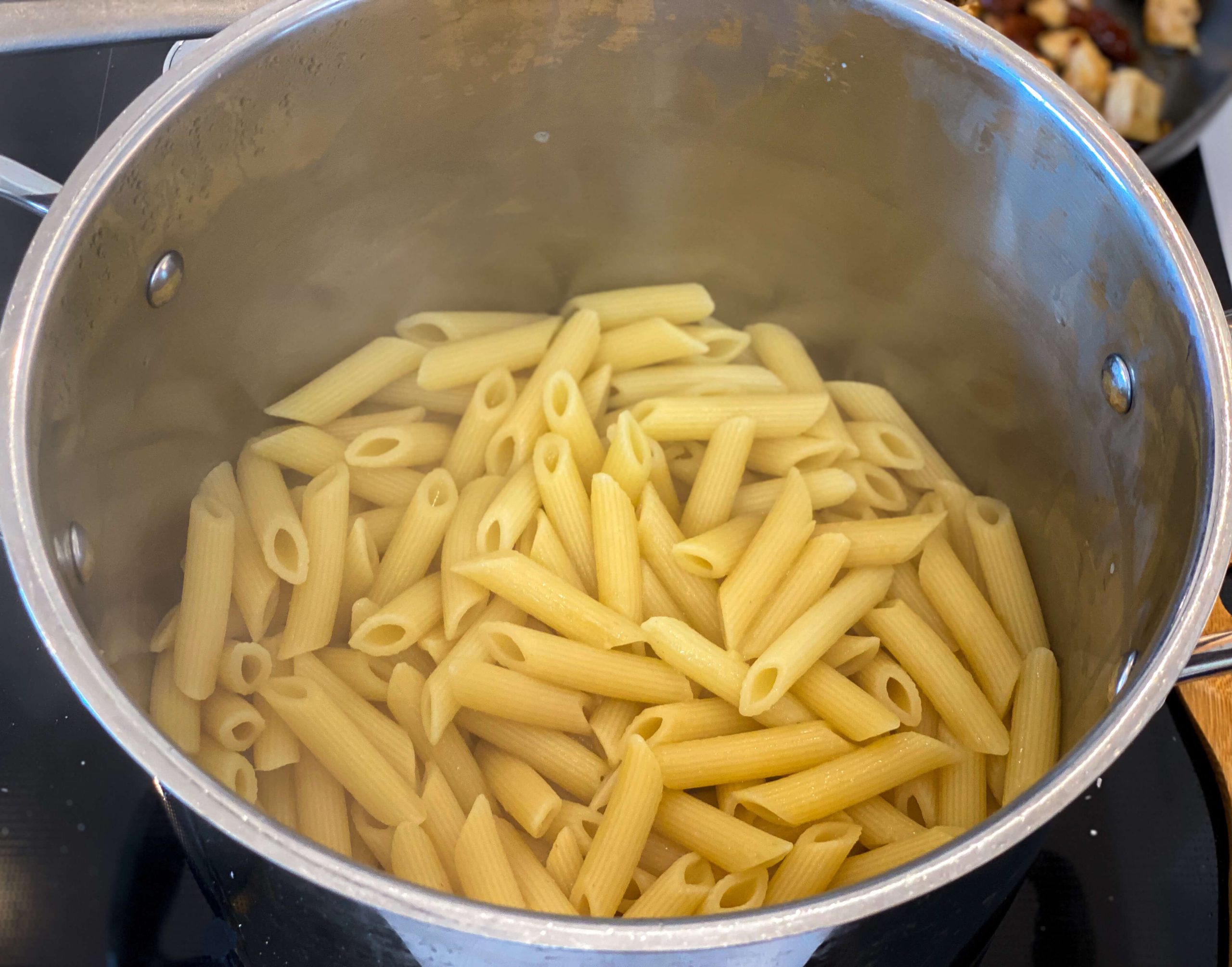 cooked pasta drained and placed back in the cooking pot
