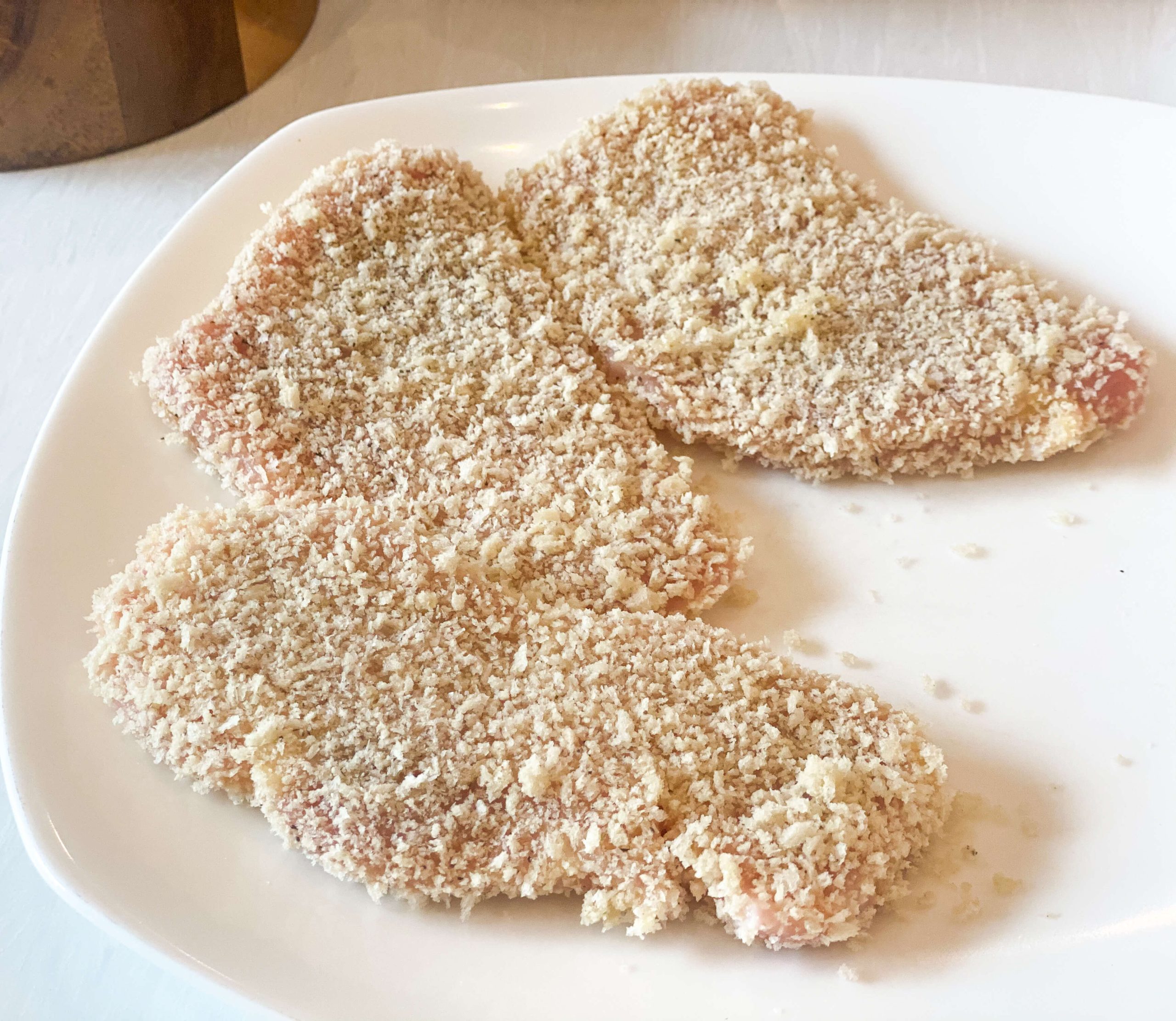 Breaded pork chops ready and set aside 