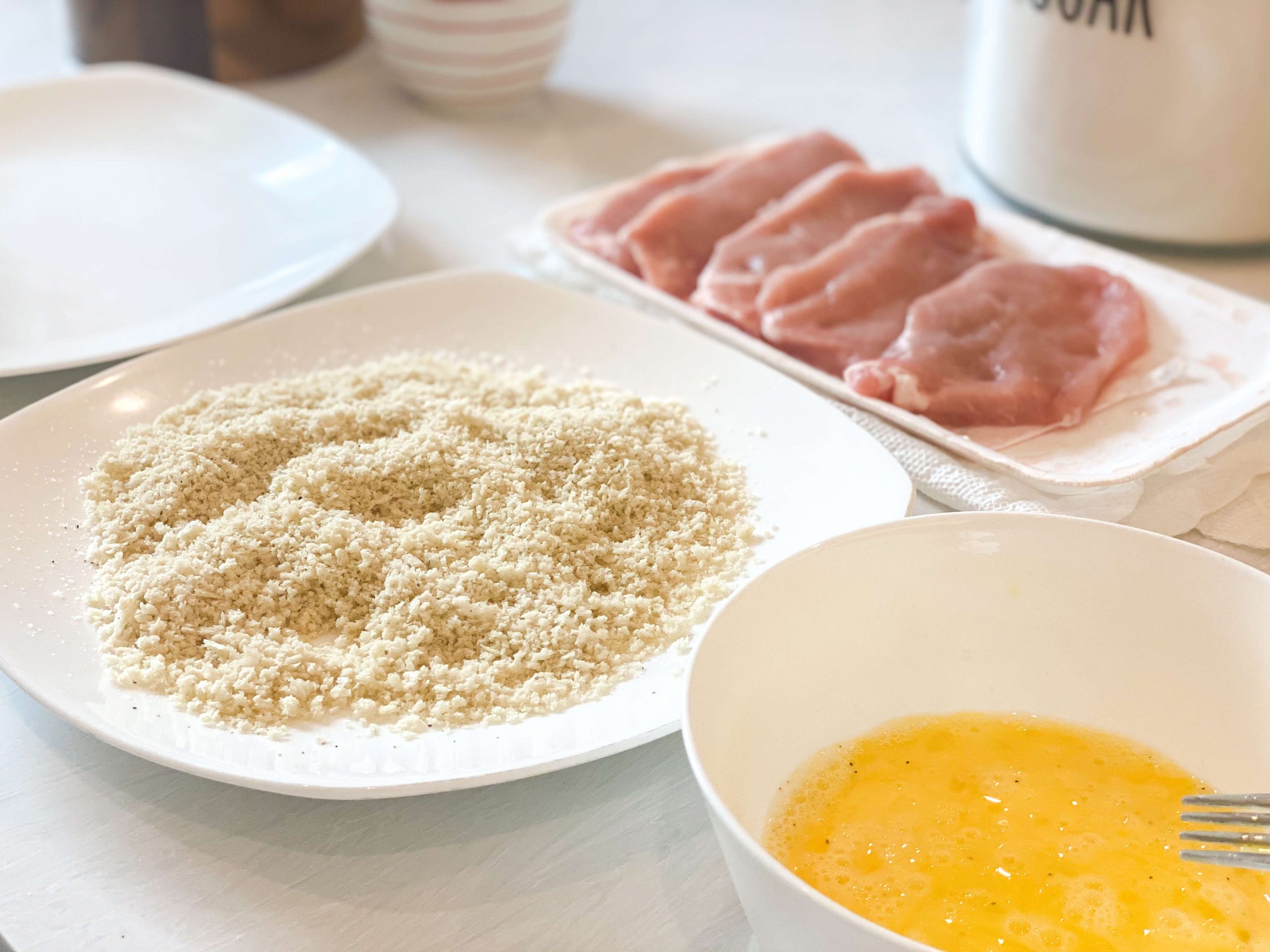 breading station for the pork chops. pano breadcrumbs, egg wash, 