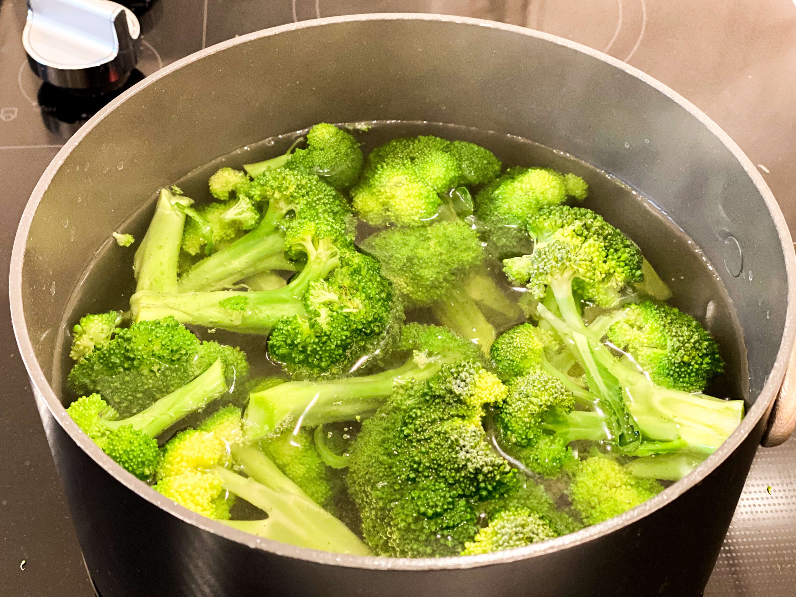 broccoli florets cooking in salted water 
