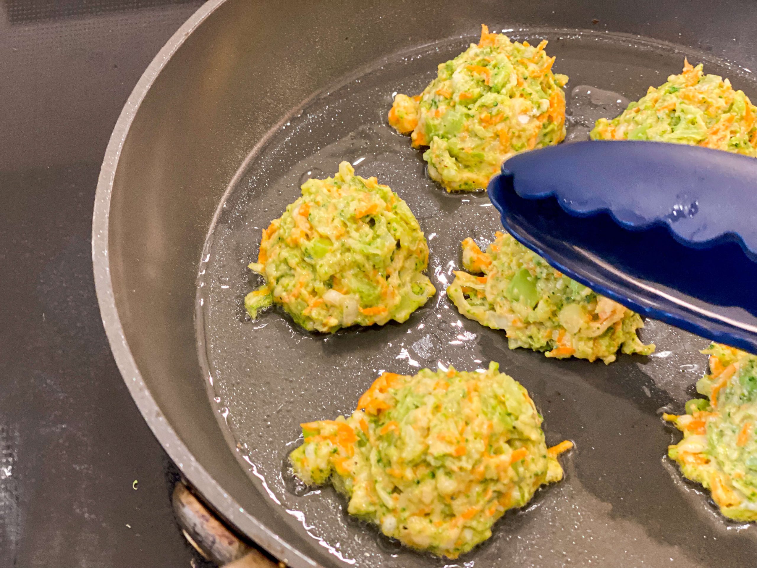 brocoli bites pan frying and getting a soft pat so they can flatten out a bit