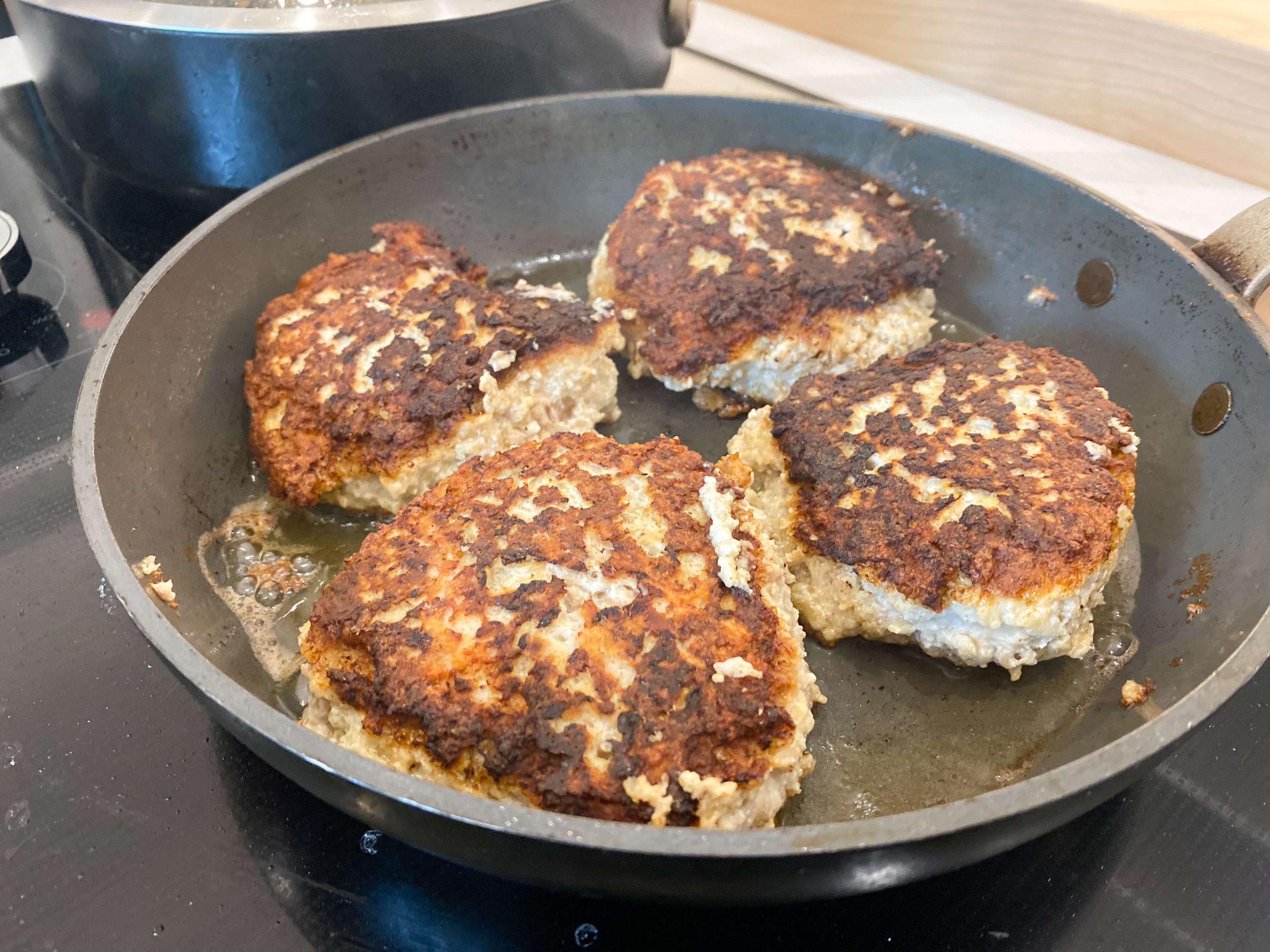 chicken burgers seared on both sides. 