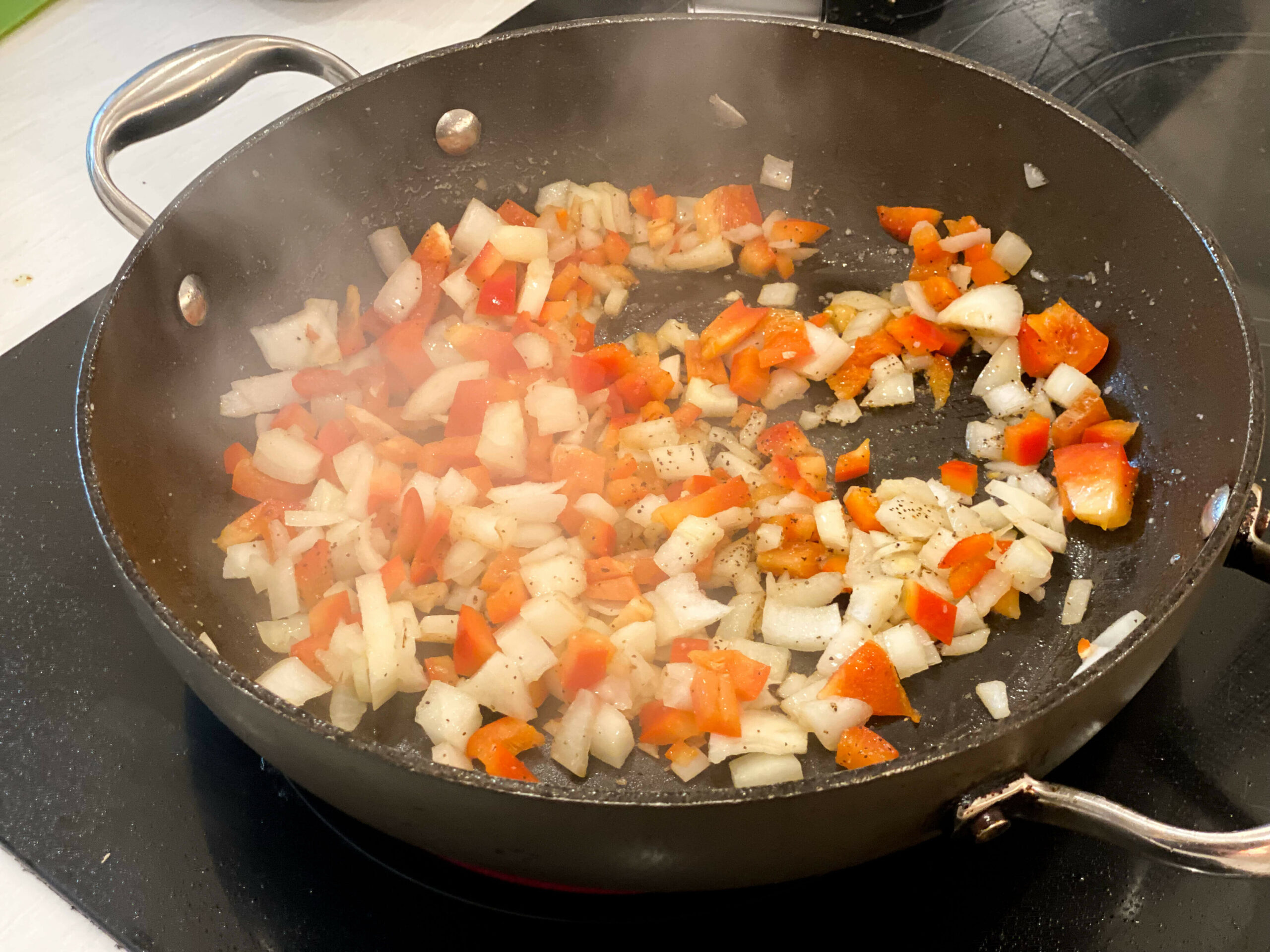 onions and peppers cooking 