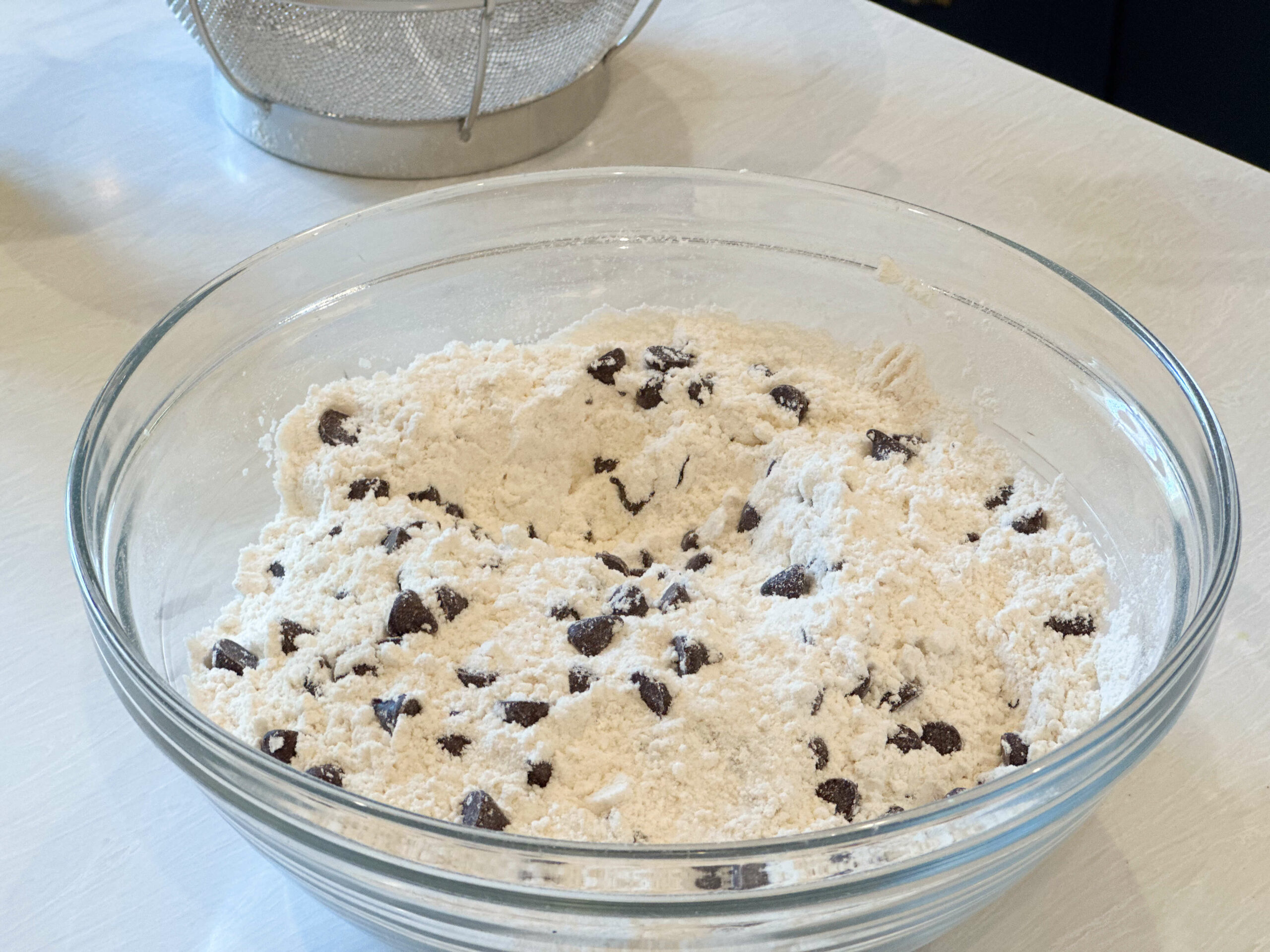 dry ingredients sifter and chocolate chips added to them