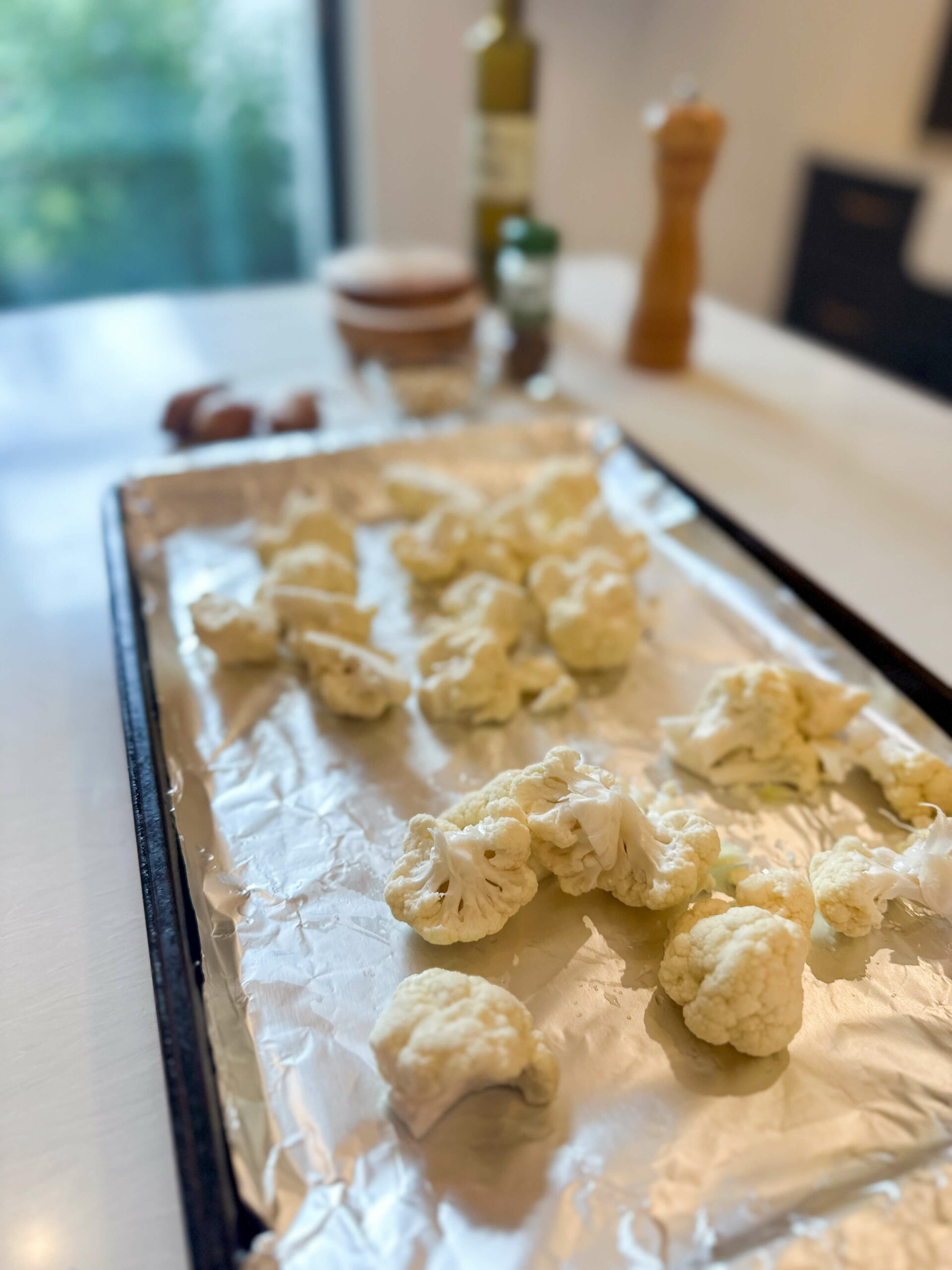 cauliflower in lined baking sheet