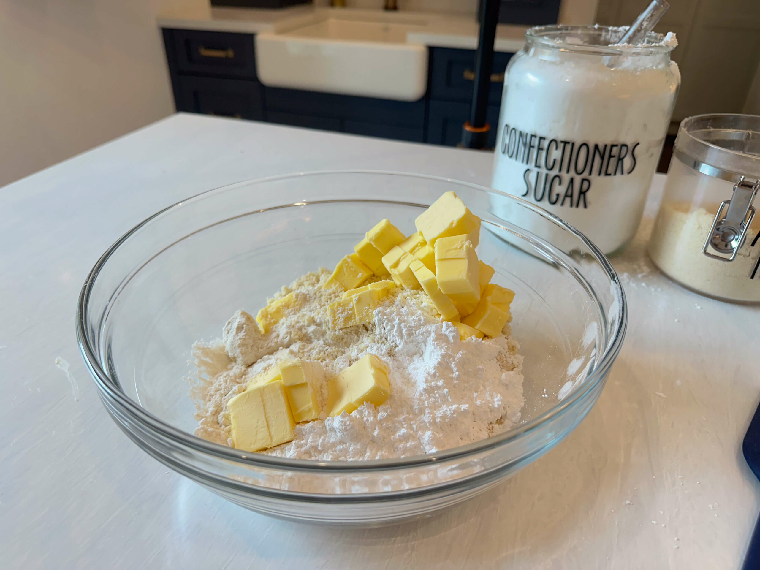 cold cuber butter with almond flour, all purpose flour, powdered sugar and a pinch of salt in a large bowl.